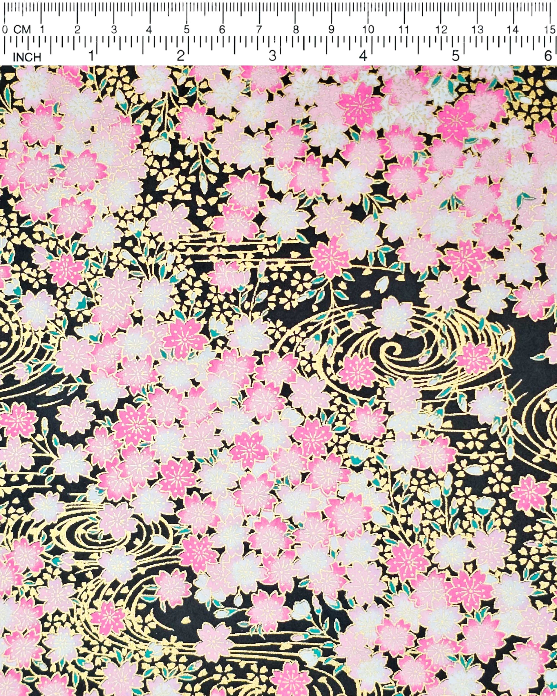 Japanese chiyogami featuring pink cherry blossoms on a black background with metallic gold accents.