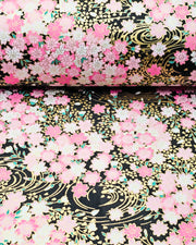 Japanese chiyogami featuring pink cherry blossoms on a black background with metallic gold accents.