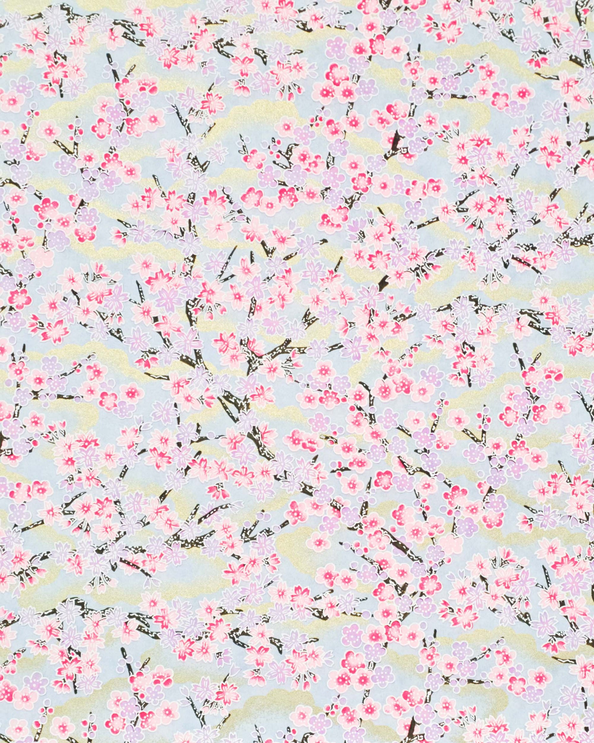 Japanese chiyogami featuring pink & purple cherry & plum blossoms on a blue background with metallic gold accents.