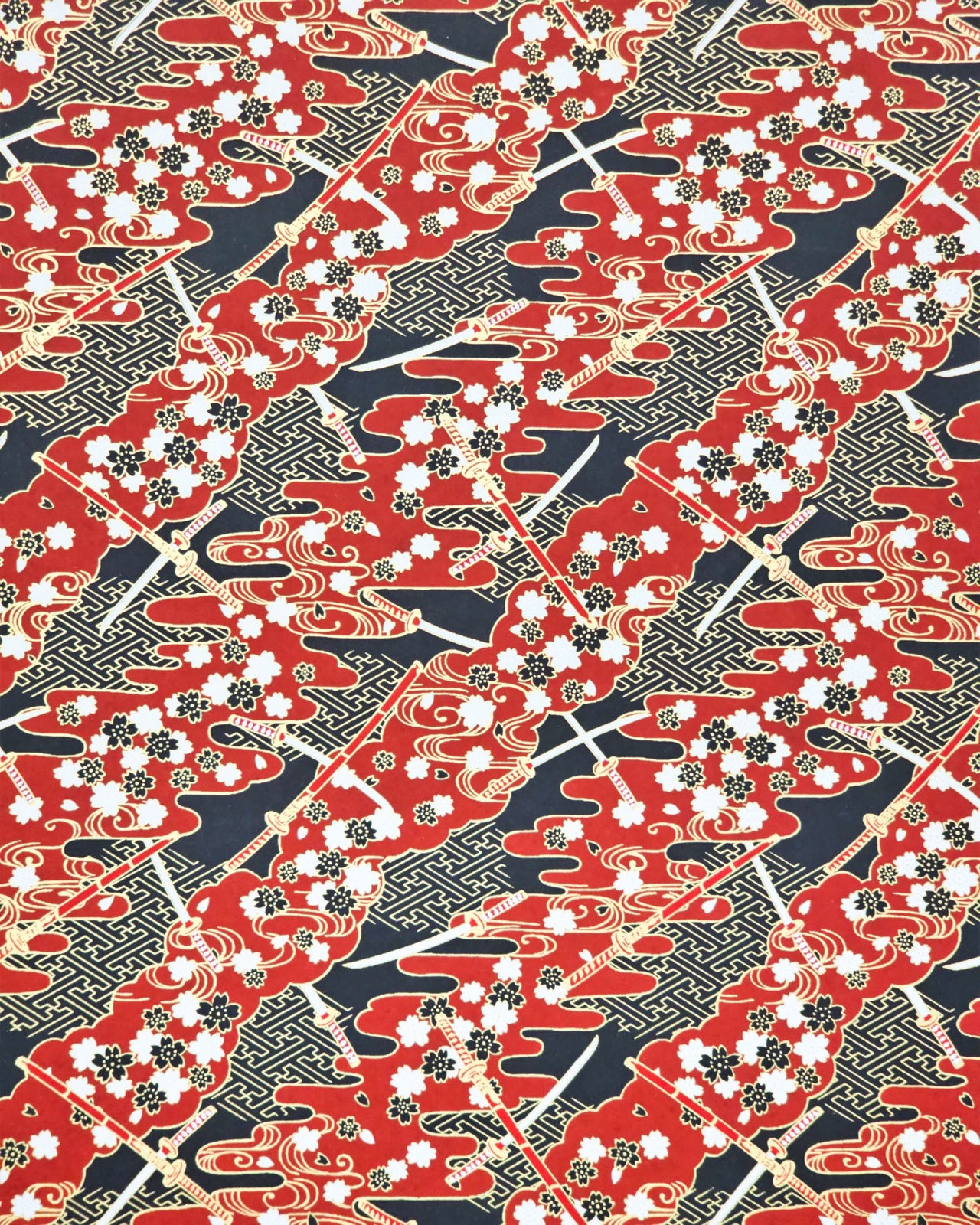 Japanese chiyogami paper featuring red & white katana swords with white & black cherry blossoms on a red & black background with metallic gold accents.