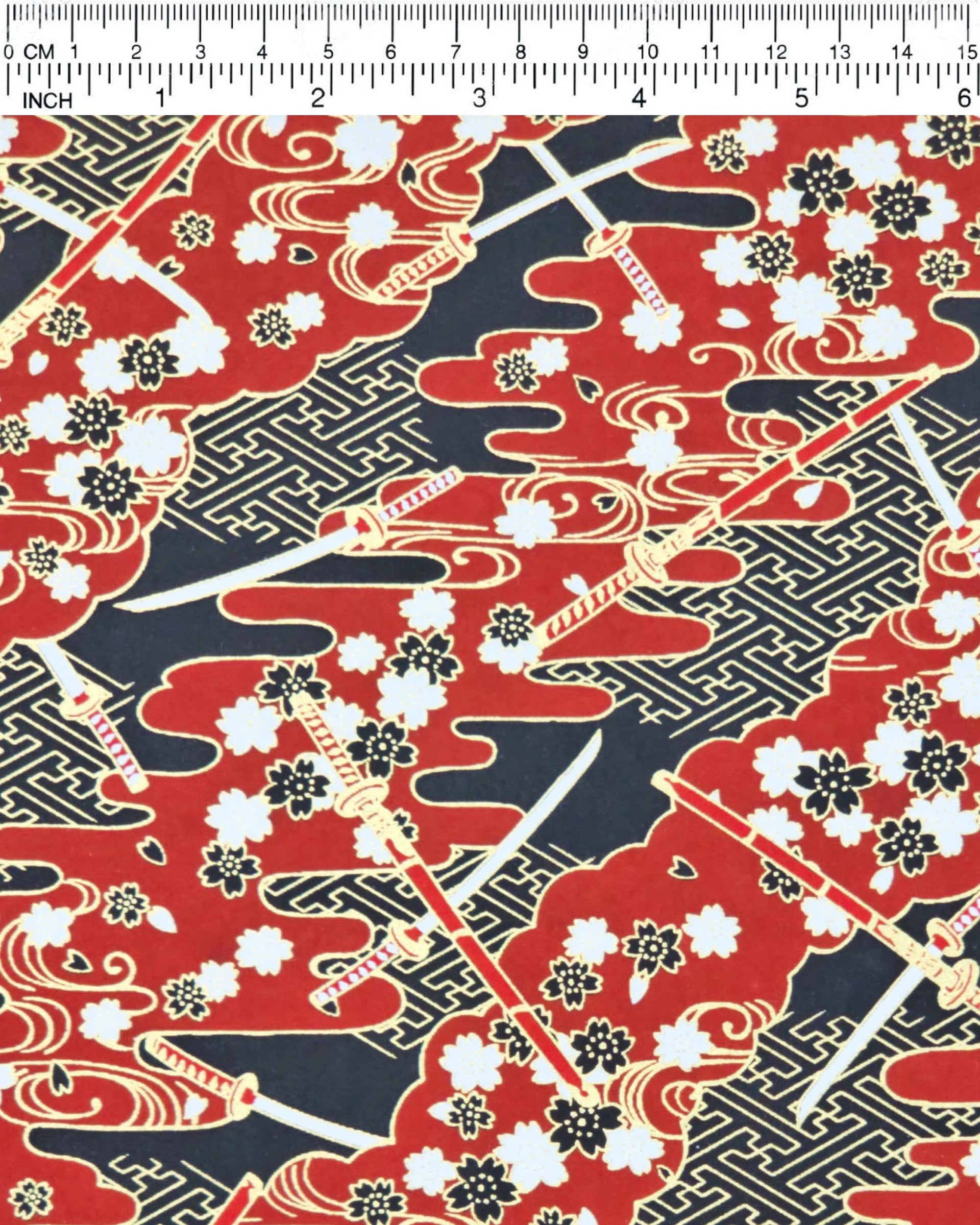 Japanese chiyogami paper featuring red & white katana swords with white & black cherry blossoms on a red & black background with metallic gold accents.
