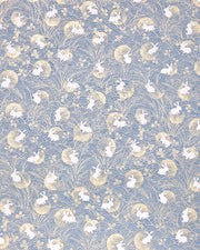 Japanese chiyogami featuring white rabbits with gold moons on a blue gray background with metallic gold accents.