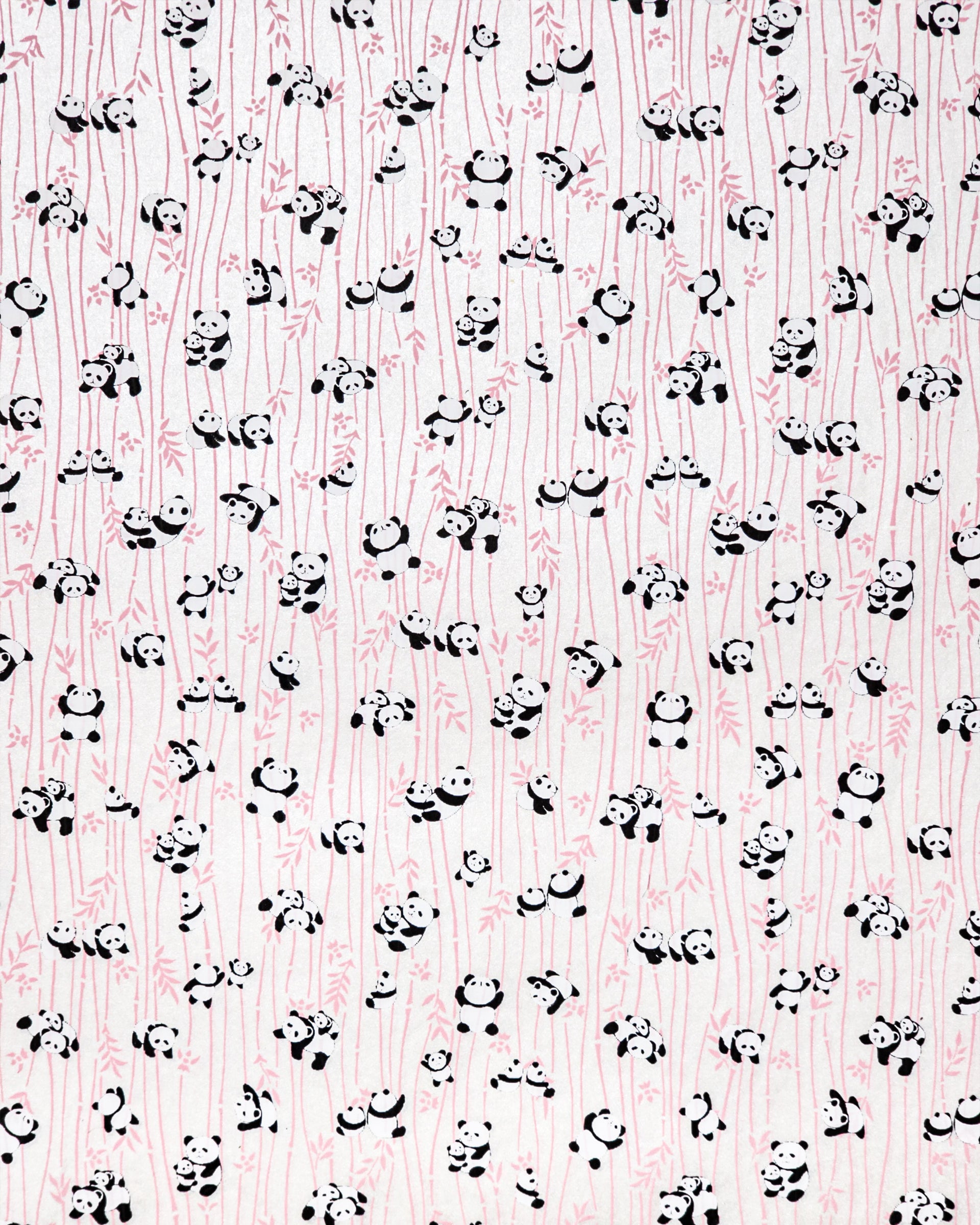 Japanese chiyogami paper featuring black & white pandas with pink bamboo on a pearlescent white background