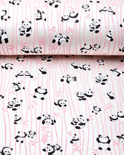 Japanese chiyogami paper featuring black & white pandas with pink bamboo on a pearlescent white background