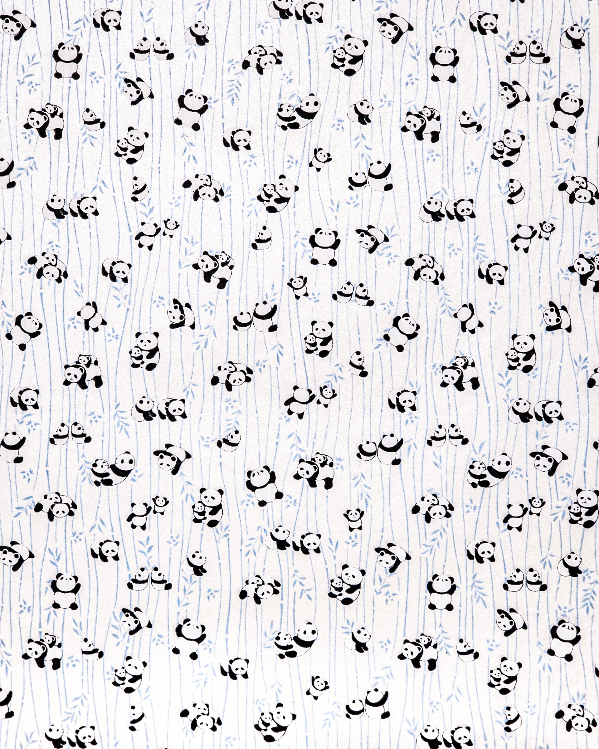Japanese chiyogami paper featuring black & white pandas with blue bamboo on a pearlescent white background.