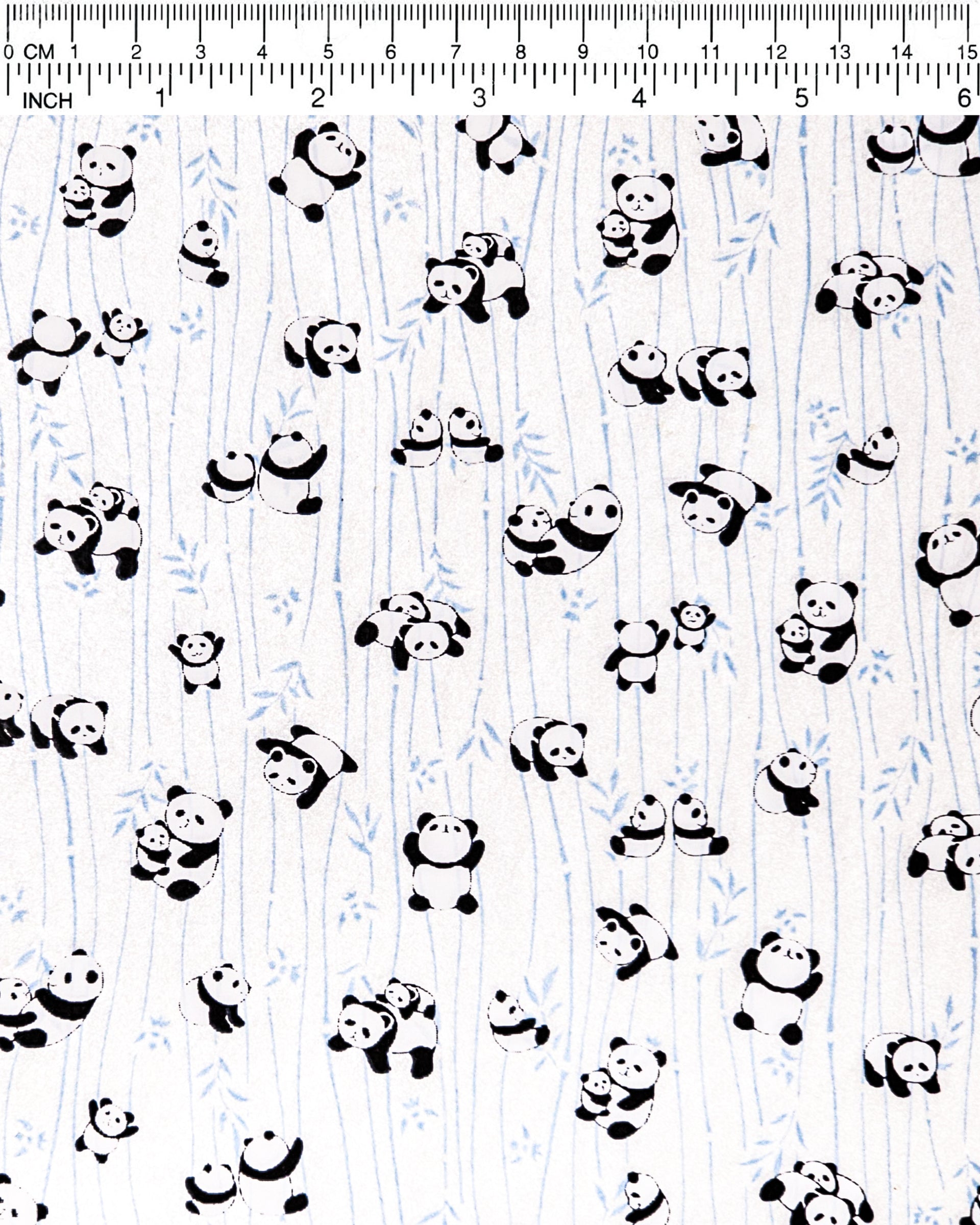 Japanese chiyogami paper featuring black & white pandas with blue bamboo on a pearlescent white background.
