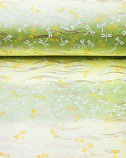 Japanese chiyogami paper featuring yellow and white dragonflies on a pearlescent green background with metallic gold accents.