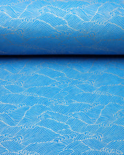 Japanese chiyogami paper featuring metallic gold waves on a royal blue background.