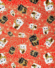 Japanese chiyogami paper featuring black & white lucky cats on a red background with metallic gold accents.