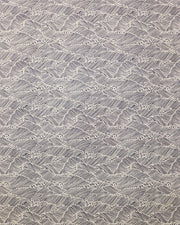 Japanese chiyogami featuring small metallic gold waves on a black background.