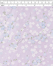 Japanese chiyogami paper featuring blue & white cherry blossoms on a pearlescent purple background.