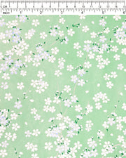 Japanese chiyogami paper featuring blue & white cherry blossoms on a pearlescent green background.