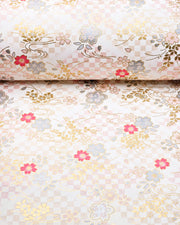 Japanese chiyogami paper featuring pink & silver cherry blossoms on a pink & beige ichimatsu (checkered) background with metallic gold accents.