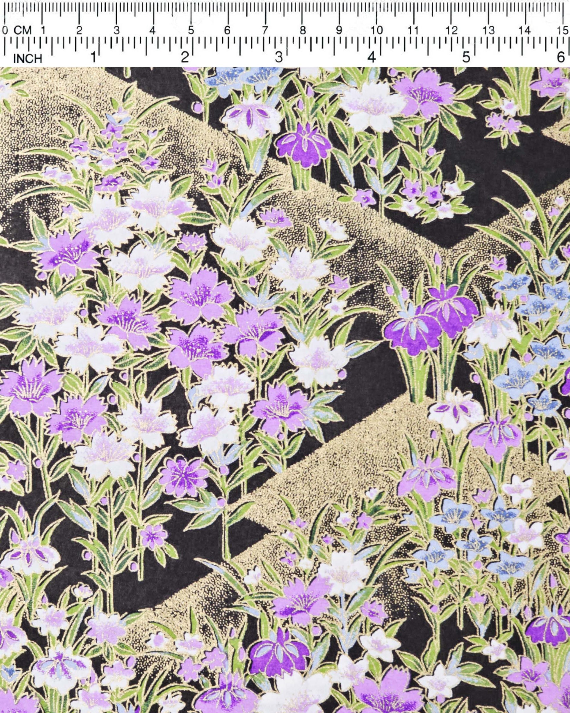 Japanese chiyogami paper featuring blue, purple, and white irises on a black background with metallic gold accents.