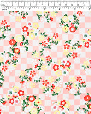 Japanese chiyogami paper featuring yellow, red, and white flowers on an orange ichimatsu (checkered) background with metallic gold accents.