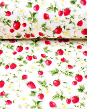 Japanese chiyogami paper featuring red strawberries with green leaves and white flowers on a pearlescent white background.