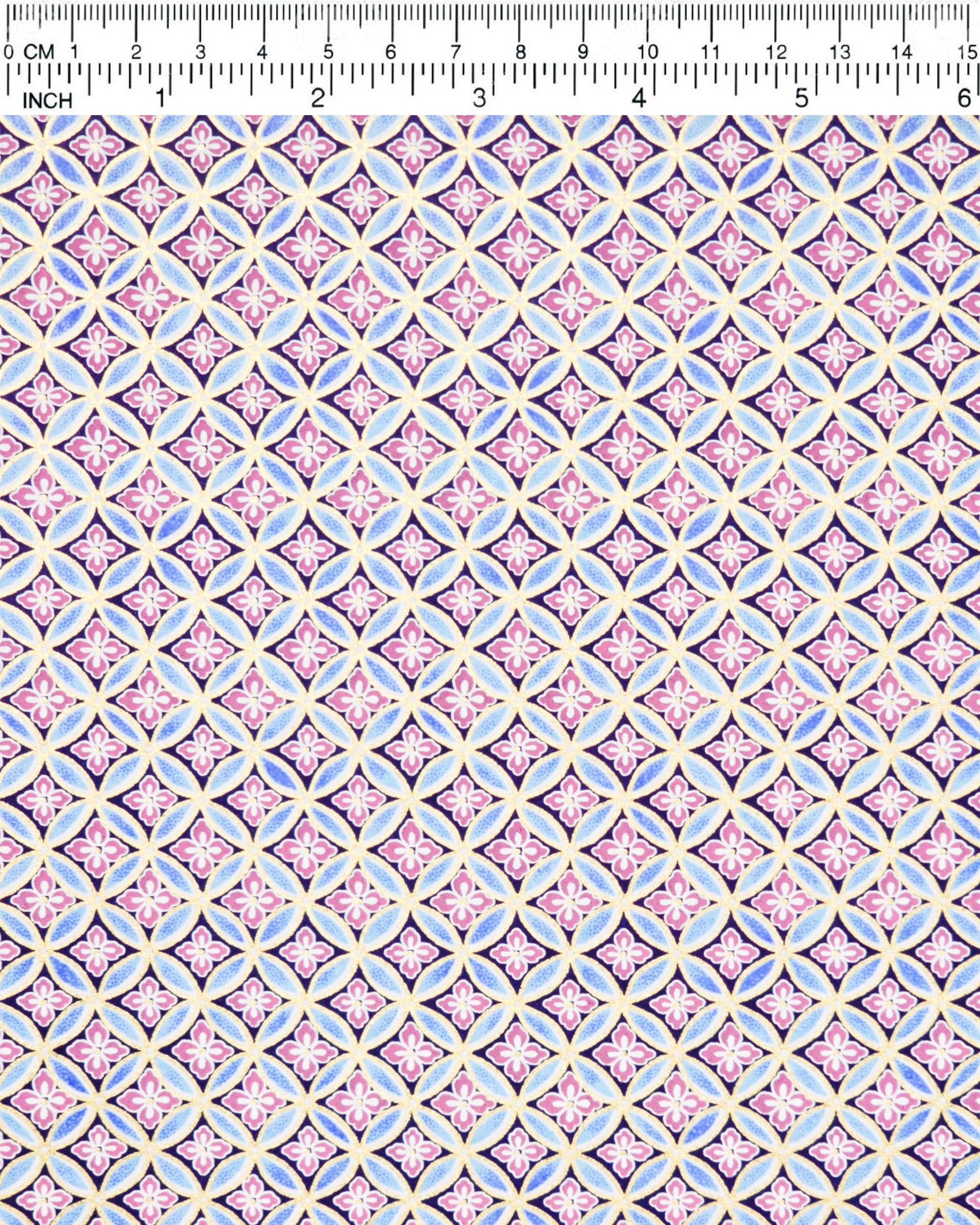 Japanese chiyogami paper featuring a blue shippo design with purple hanabishi in the center with metallic gold accents.