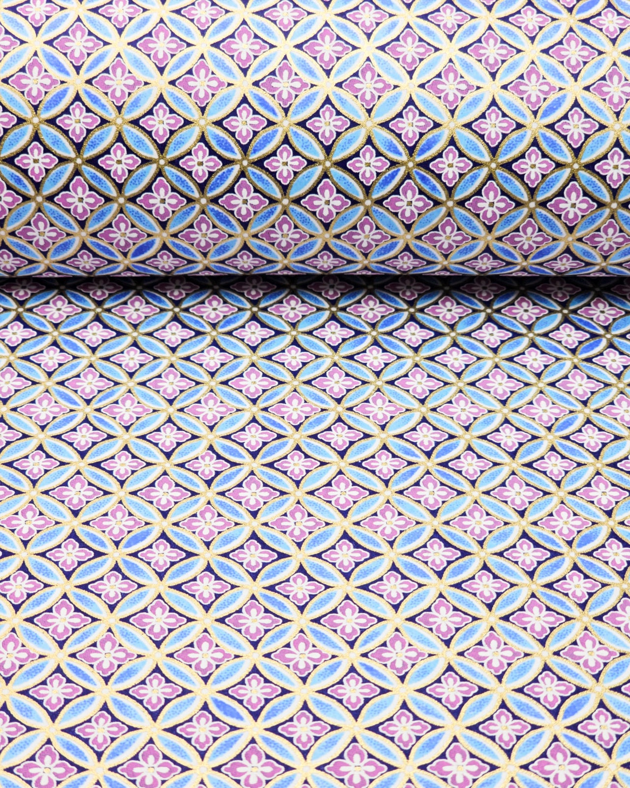 Japanese chiyogami paper featuring a blue shippo design with purple hanabishi in the center with metallic gold accents.