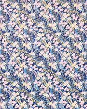 Japanese chiyogami paper featuring pink & yellow plum blossoms with blue, pink, and yellow wisteria on a dark blue back ground with  metallic gold accents.