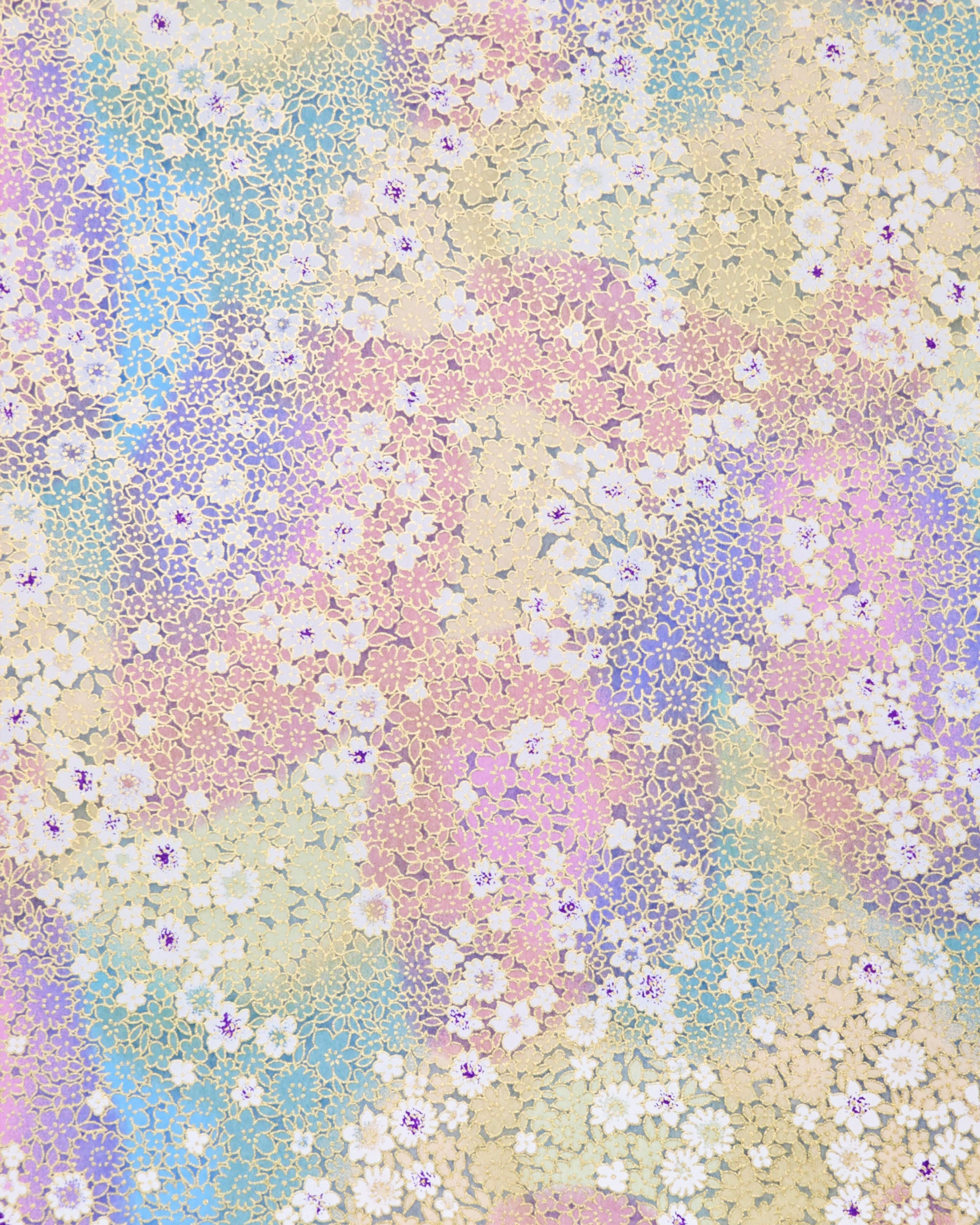 Japanese chiyogami paper featuring small rainbow-colored flowers with metallic gold accents.