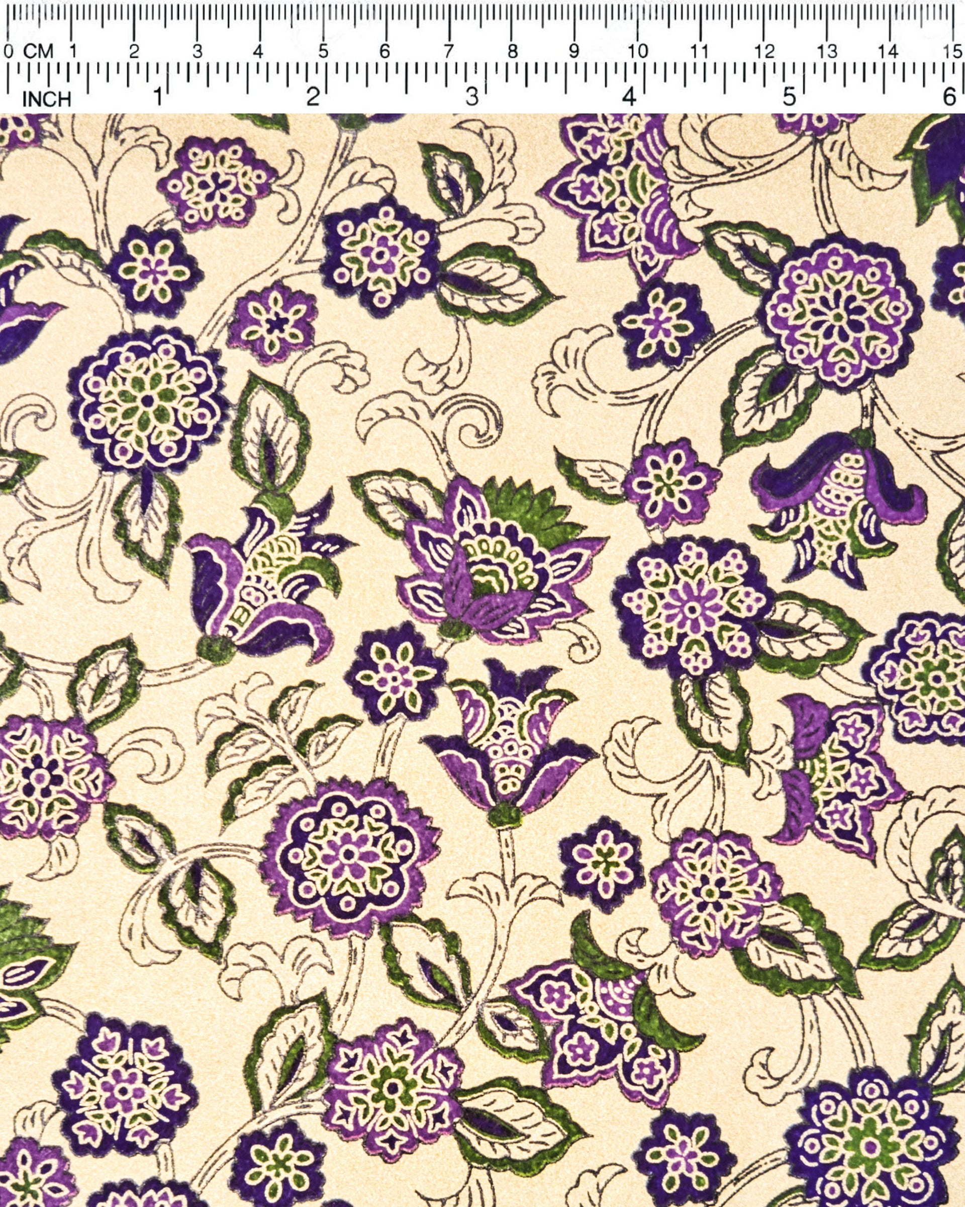 Japanese chiyogami paper featuring purple & green sarasa flowers on a metallic gold background.