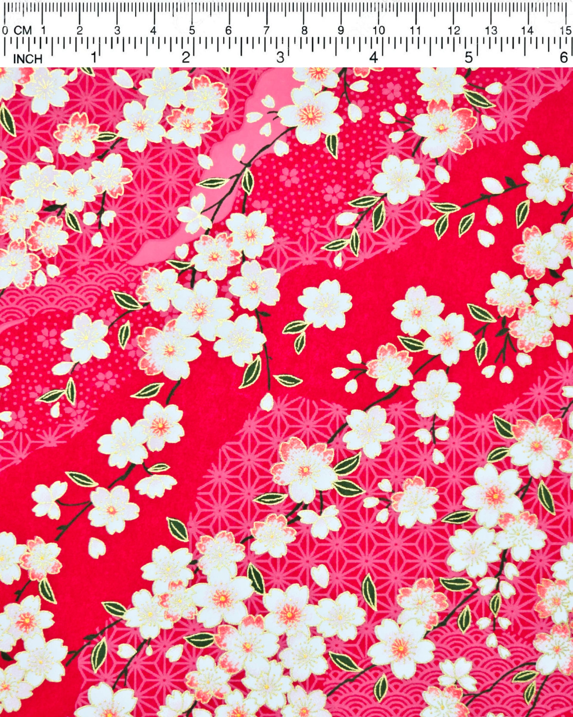 Japanese chiyogami paper featuring pink & white cherry blossoms on a red background with metallic gold accents.