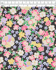 Japanese chiyogami paper featuring pink, yellow, purple, and white cherry blossoms and purple yukiwas on a black background with metallic gold accents.