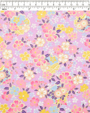 Japanese chiyogami paper featuring pink, yellow, blue, and white cherry blossoms and purple yukiwas on a purple background with metallic gold accents.