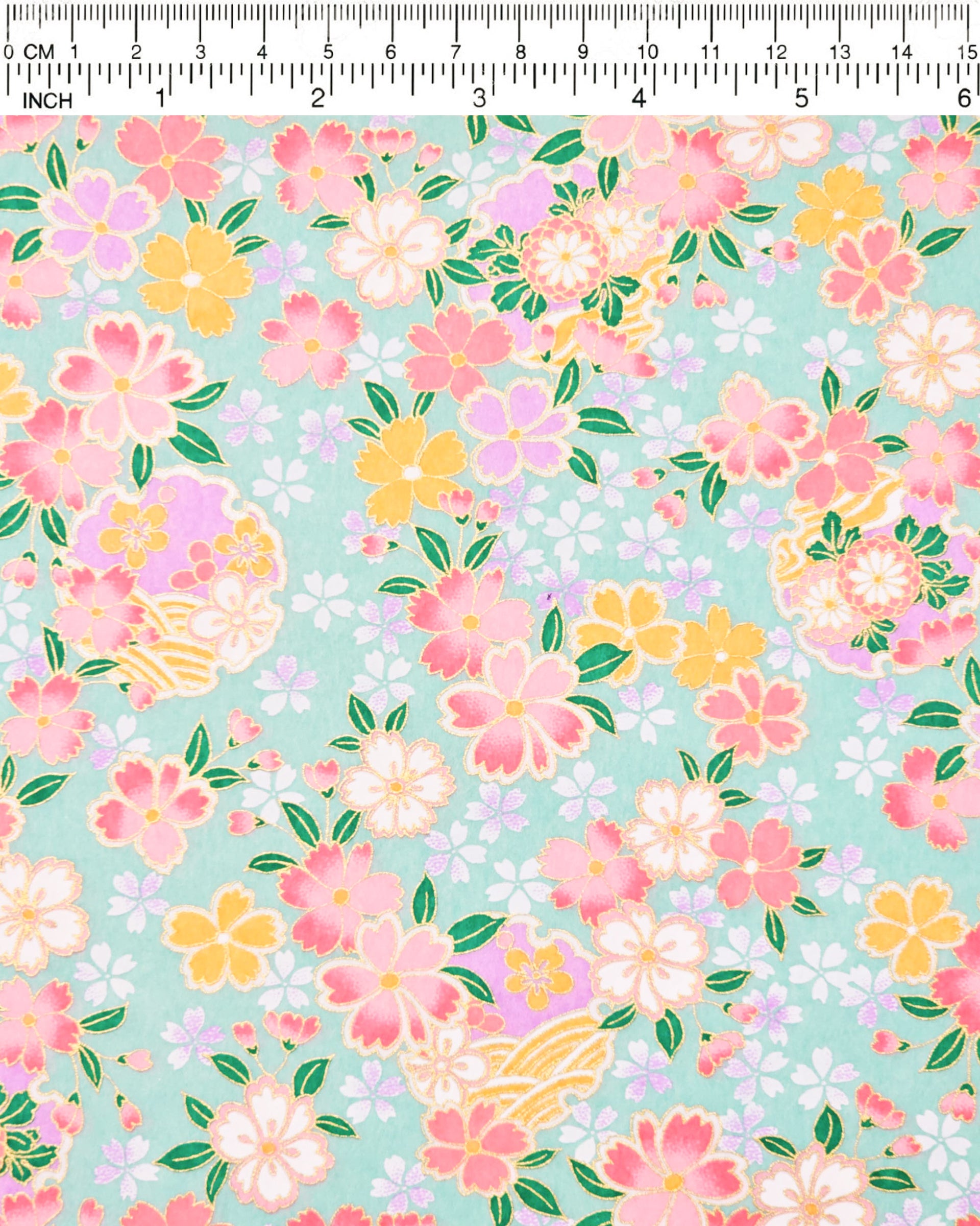 Japanese chiyogami paper featuring pink, yellow, purple, and white cherry blossoms and purple yukiwas on a turquoise background with metallic gold accents.