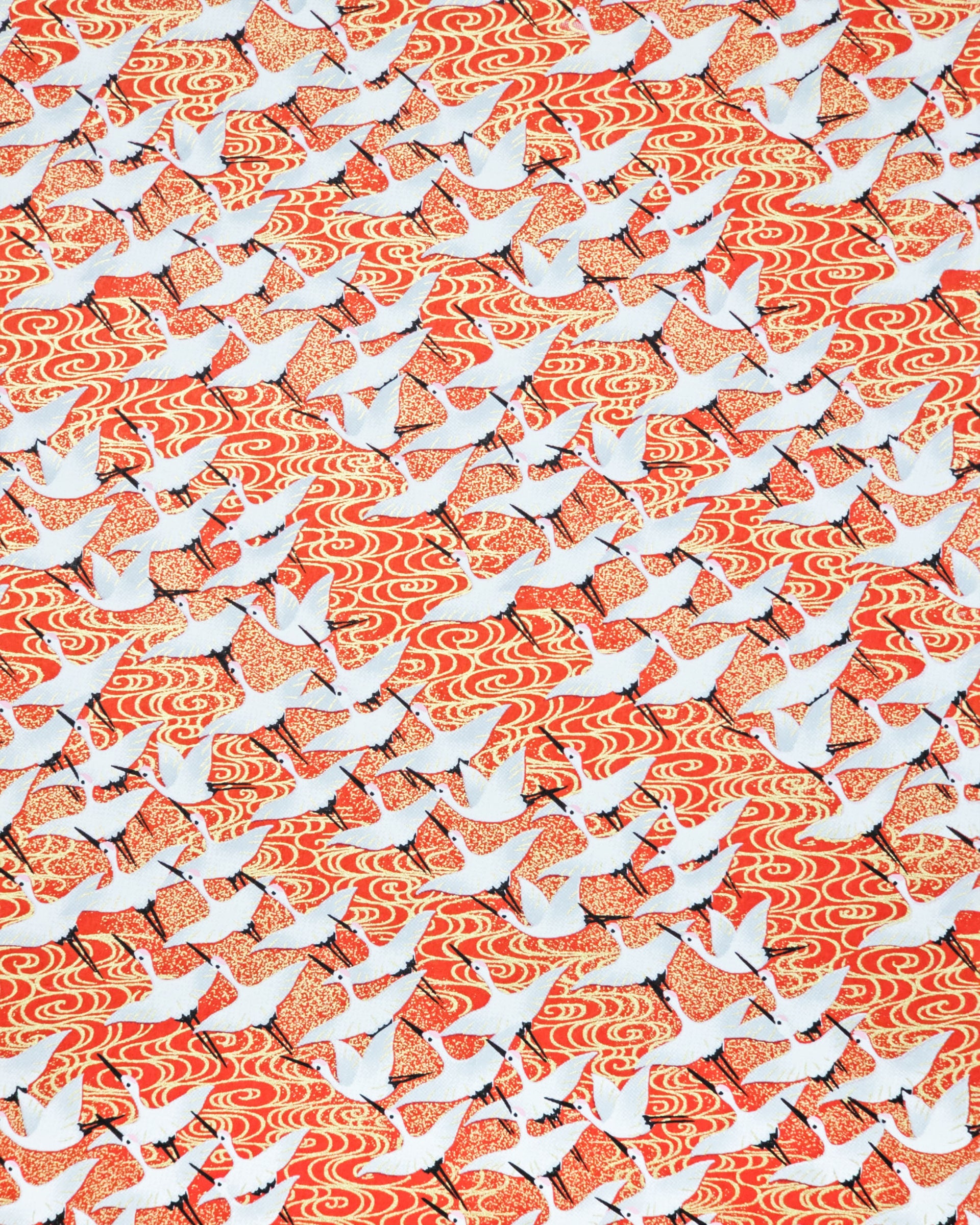 Japanese chiyogami paper featuring white flying cranes on an red background with metallic gold accents.
