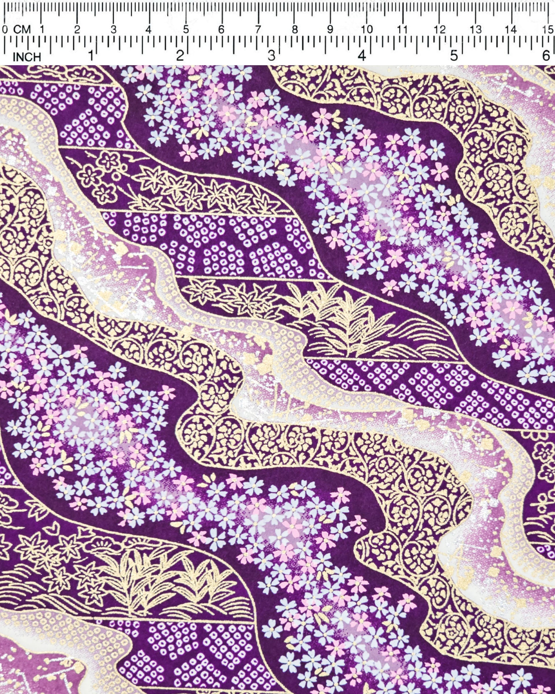 Japanese chiyogami paper featuring pink & white cherry blossoms on purple background with metallic gold & silver accents.
