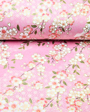 Japanese chiyogami paper featuring pink & white cherry blossoms on light pink background with metallic gold accents.