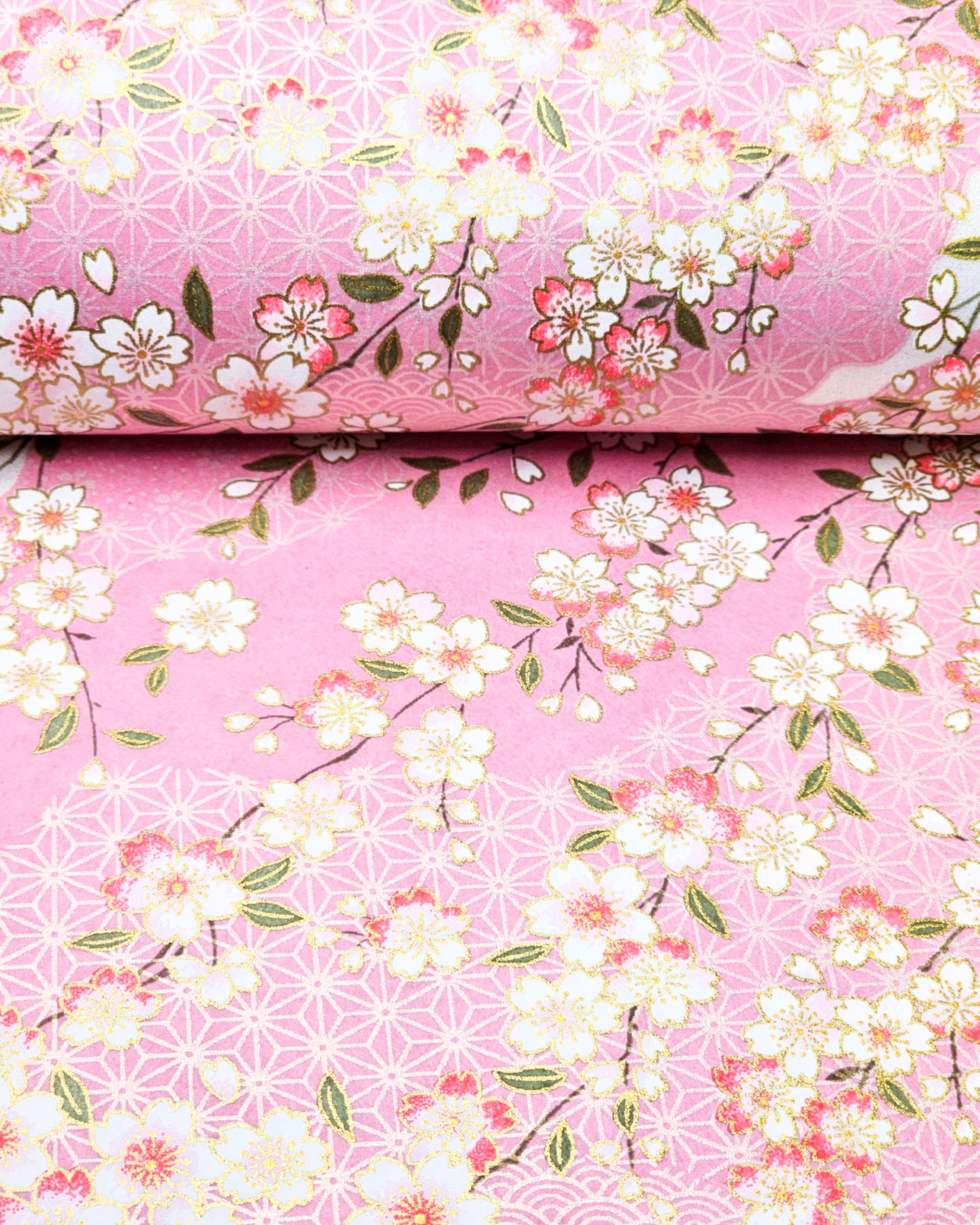 Japanese chiyogami paper featuring pink & white cherry blossoms on light pink background with metallic gold accents.