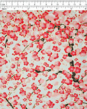 Japanese chiyogami paper featuring a red plum blossom tree with a dark brown tree trunk on a metallic silver background with metallic gold accents.