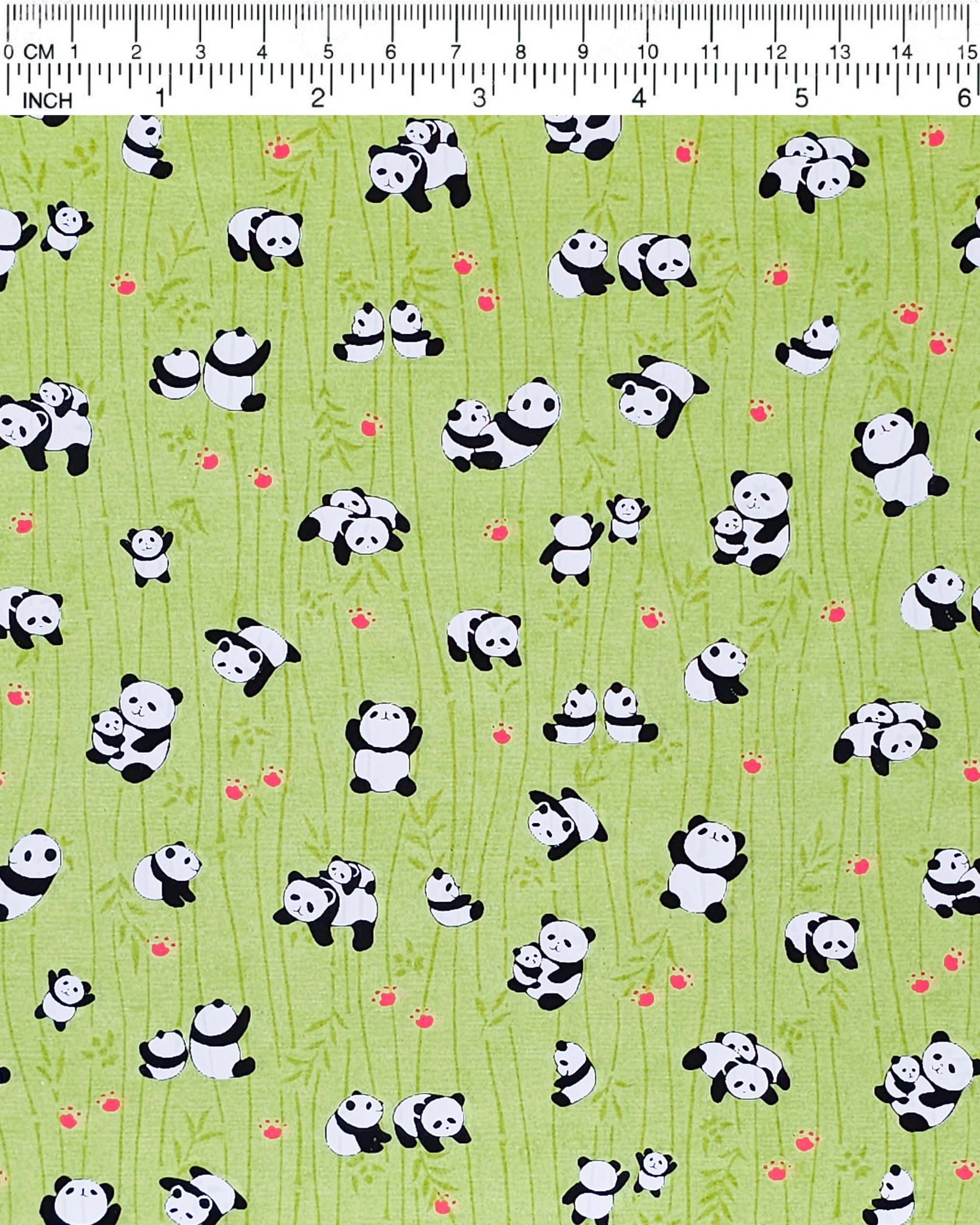 Japanese chiyogami featuring small pandas and small red paw prints on a green background with green bamboo.