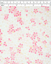 Japanese chiyogami paper featuring white & pink cherry blossoms on a white & light pink background with metallic gold accents.