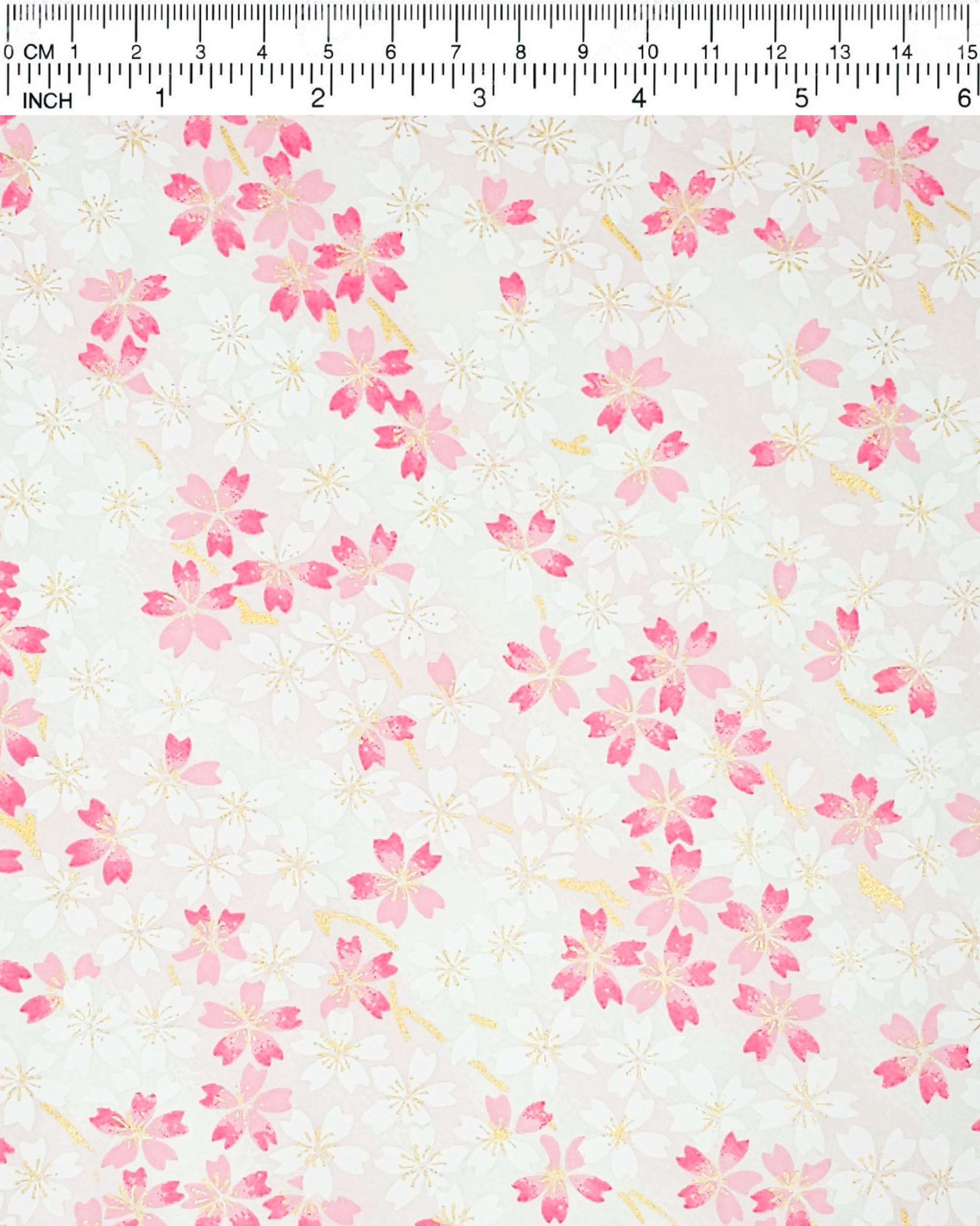 Japanese chiyogami paper featuring white & pink cherry blossoms on a white & light pink background with metallic gold accents.