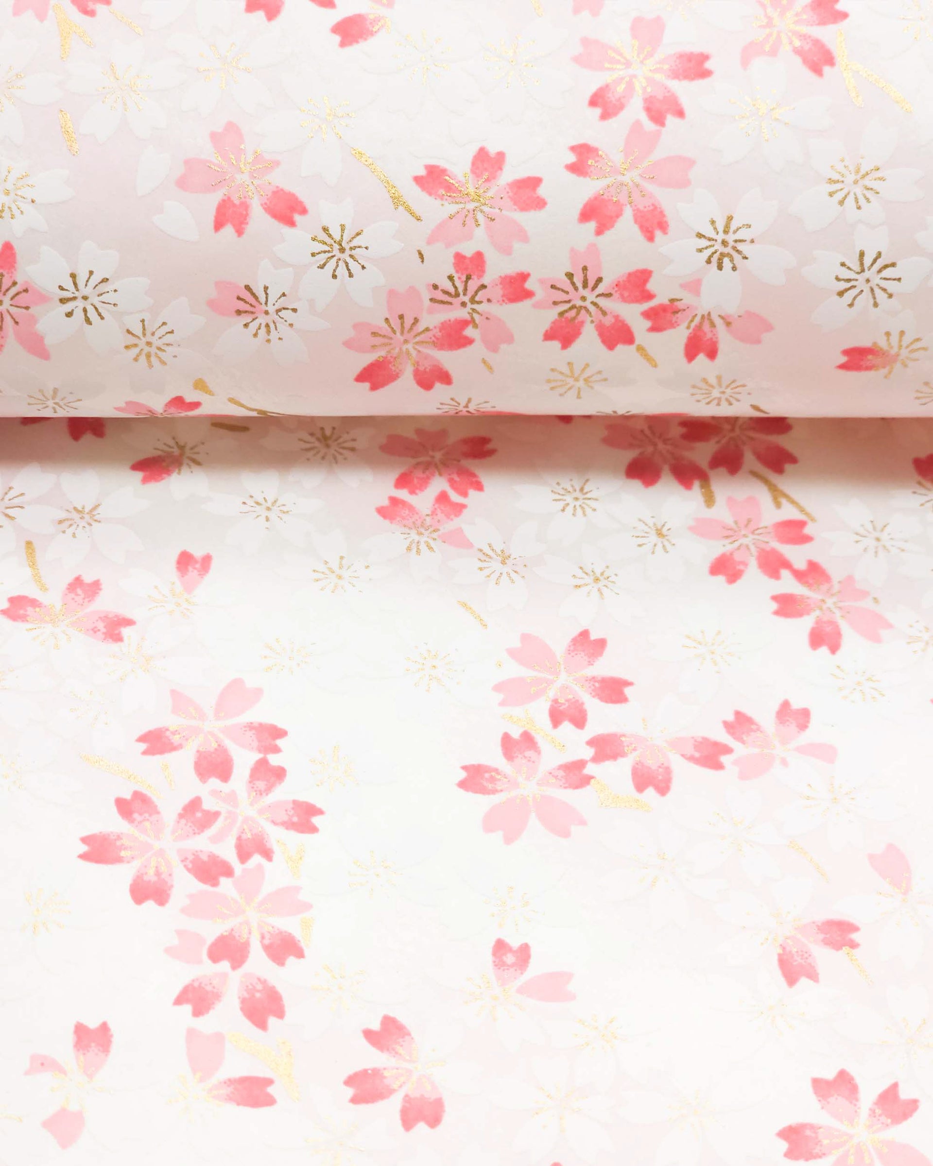 Japanese chiyogami paper featuring white & pink cherry blossoms on a white & light pink background with metallic gold accents.