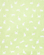 Japanese chiyogami featuring white cats with red collars on a green asanoha (hemp leaf) background.