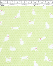 Japanese chiyogami featuring white cats with red collars on a green asanoha (hemp leaf) background.