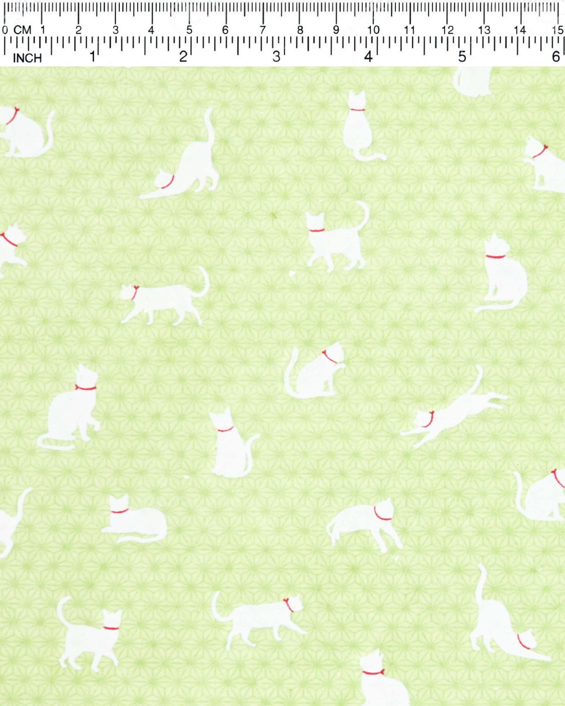Japanese chiyogami featuring white cats with red collars on a green asanoha (hemp leaf) background.
