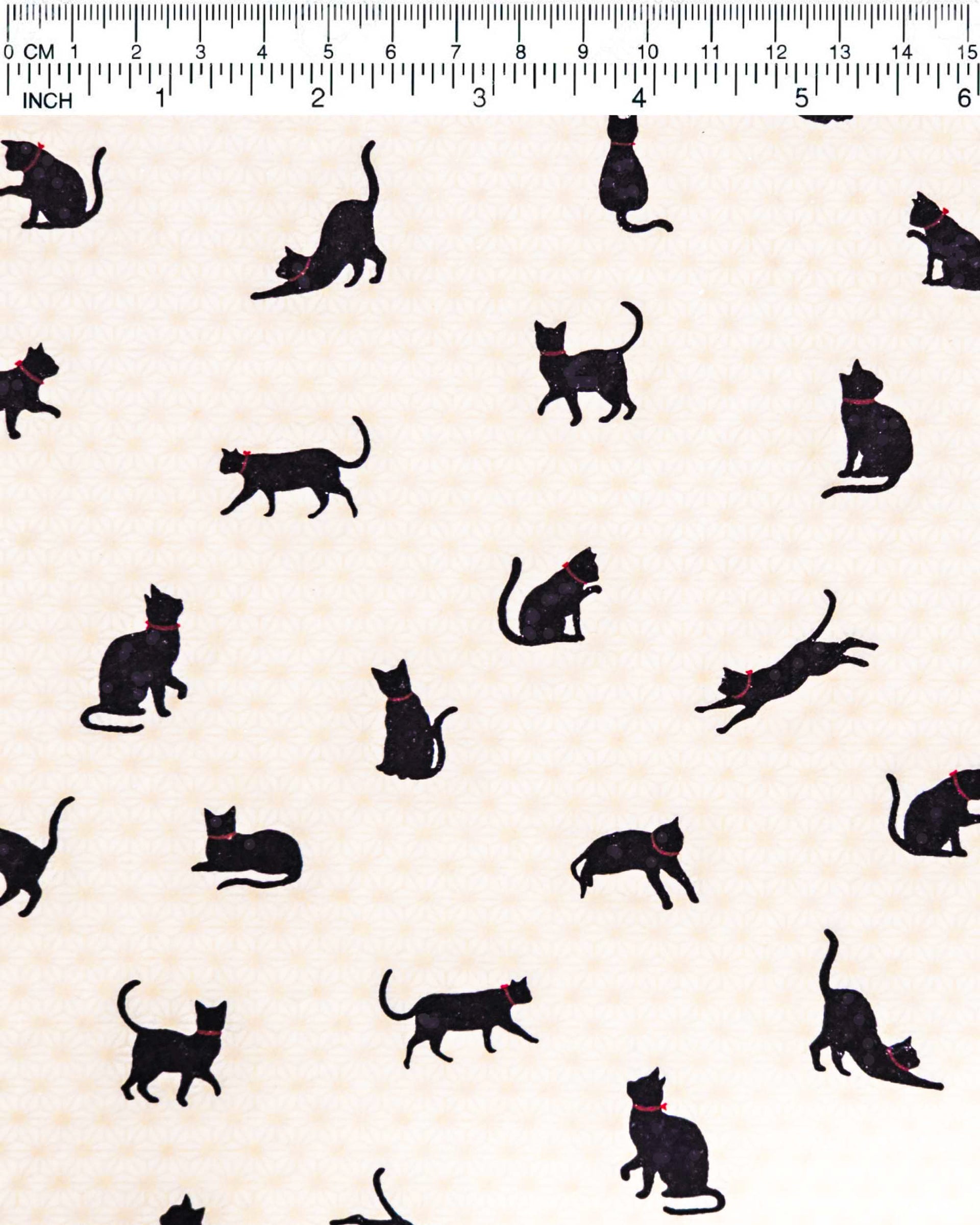Japanese chiyogami paper featuring black cats with red collars on a beige asanoha (hemp leaf) background.