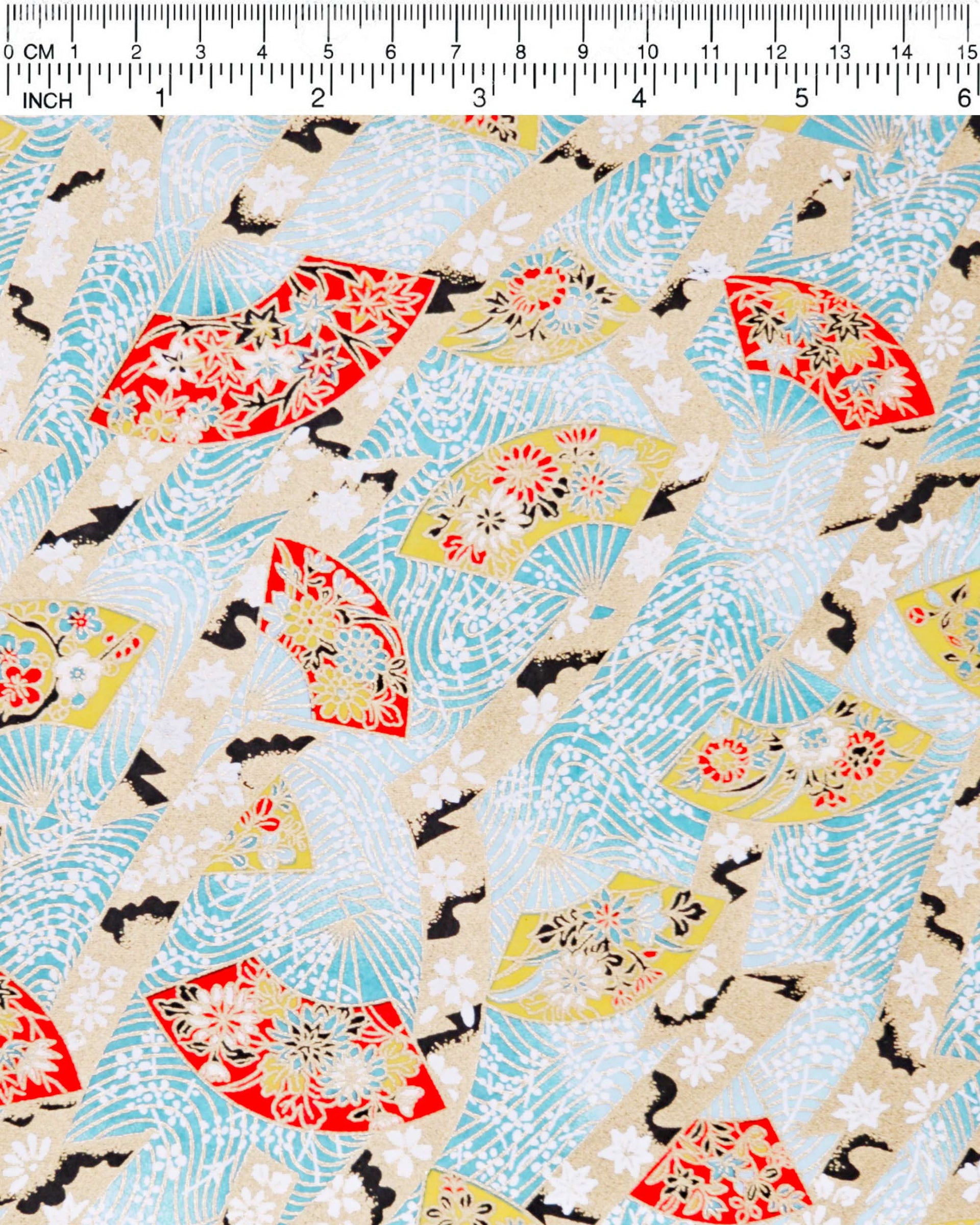Japanese chiyogami paper featuring yellow & red hand fans on a blue background with metallic gold accents.