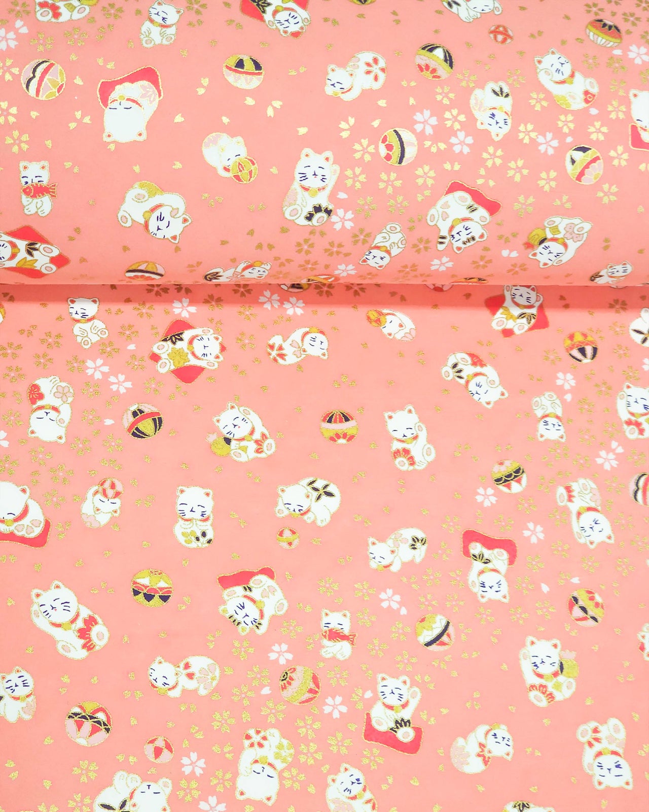 Japanese chiyogami featuring white Maneki Neko lucky cats on a pink background with metallic gold accents.