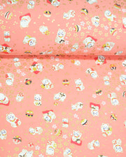 Japanese chiyogami featuring white Maneki Neko lucky cats on a pink background with metallic gold accents.