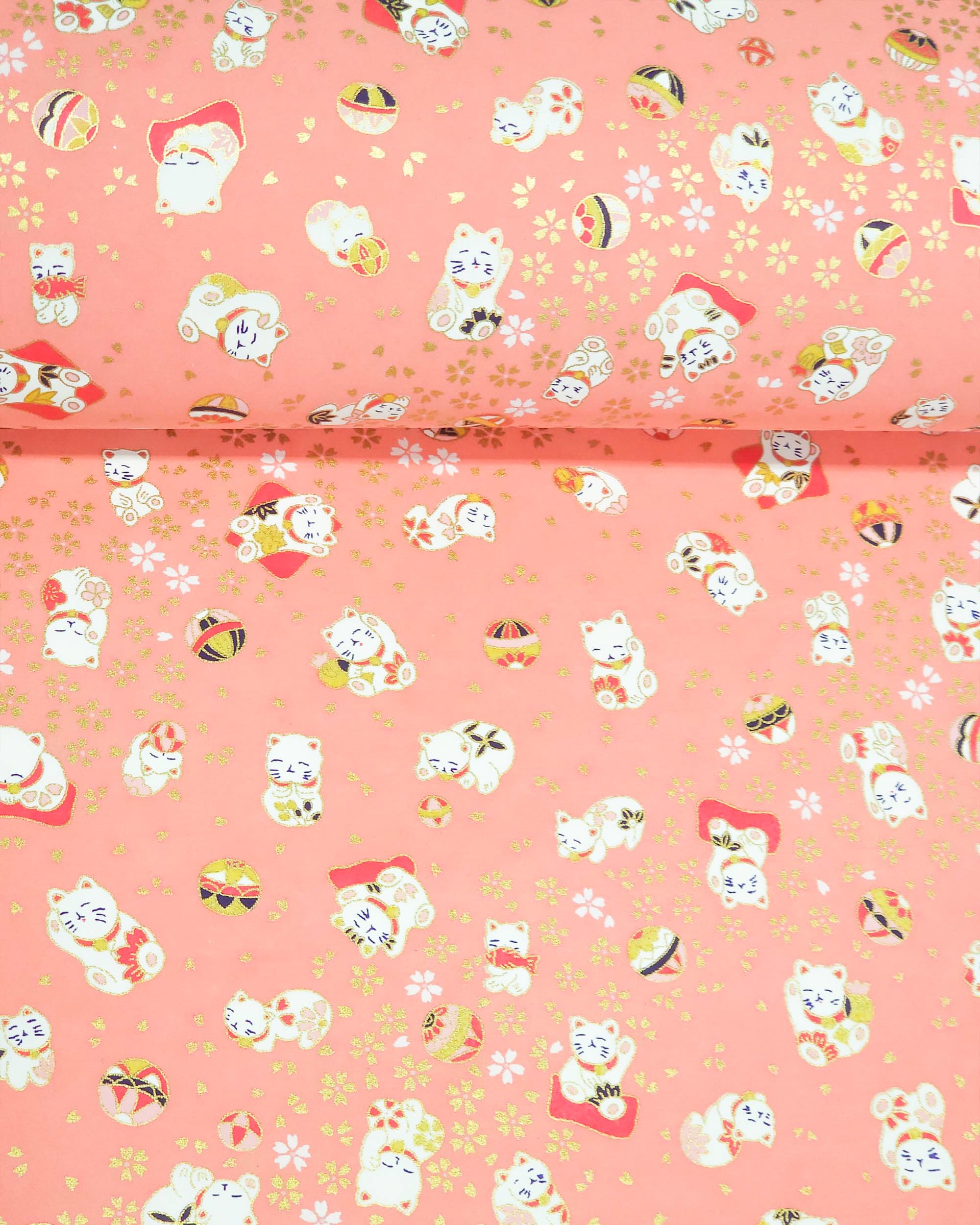 Japanese chiyogami featuring white Maneki Neko lucky cats on a pink background with metallic gold accents.