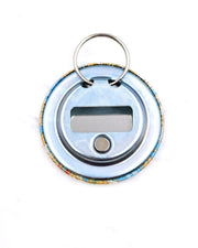 Magnetic bottle opener featuring beige leaves on a light blue background with metallic gold accents.