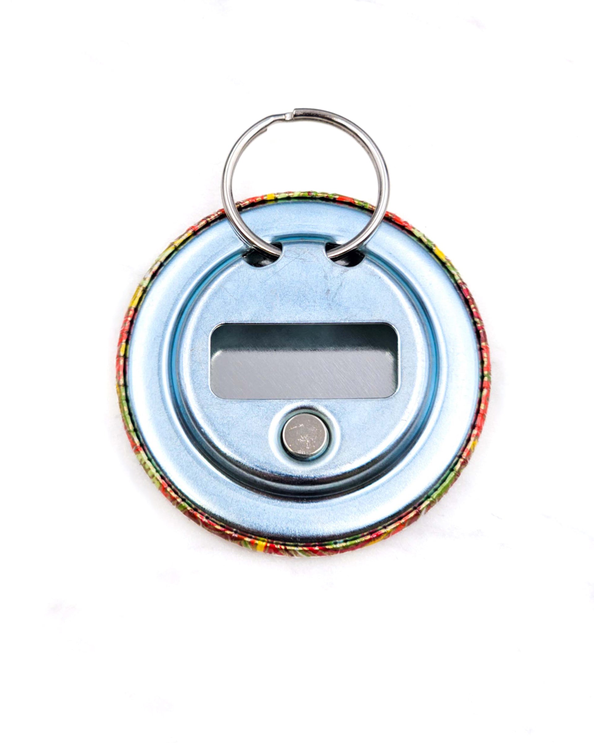 Magnetic bottle opener featuring a green and yellow paisley design on an orange background with metallic gold accents.