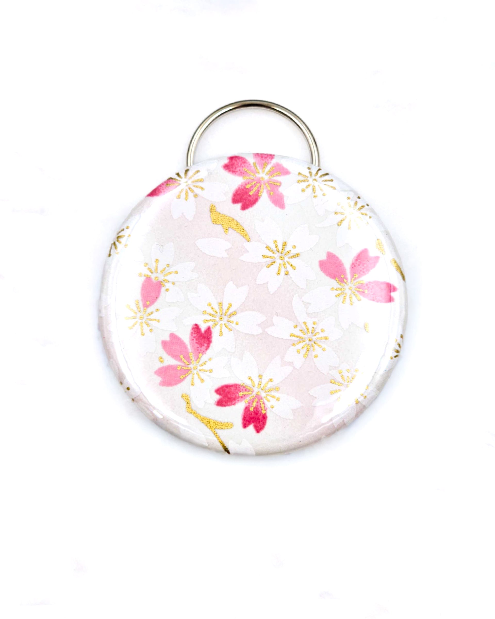 Magnetic bottle opener featuring pink and white cherry blossoms on a white background with metallic gold accents.