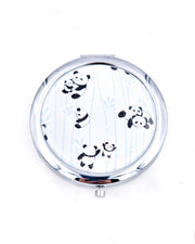 Silver metal compact mirror featuring pandas and blue bamboo on a pearlescent white background.